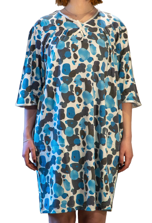 Women's sleeveless adaptive open back gown with a dotted pattern in shades of blue and gray, featuring two snap closures at the shoulders.