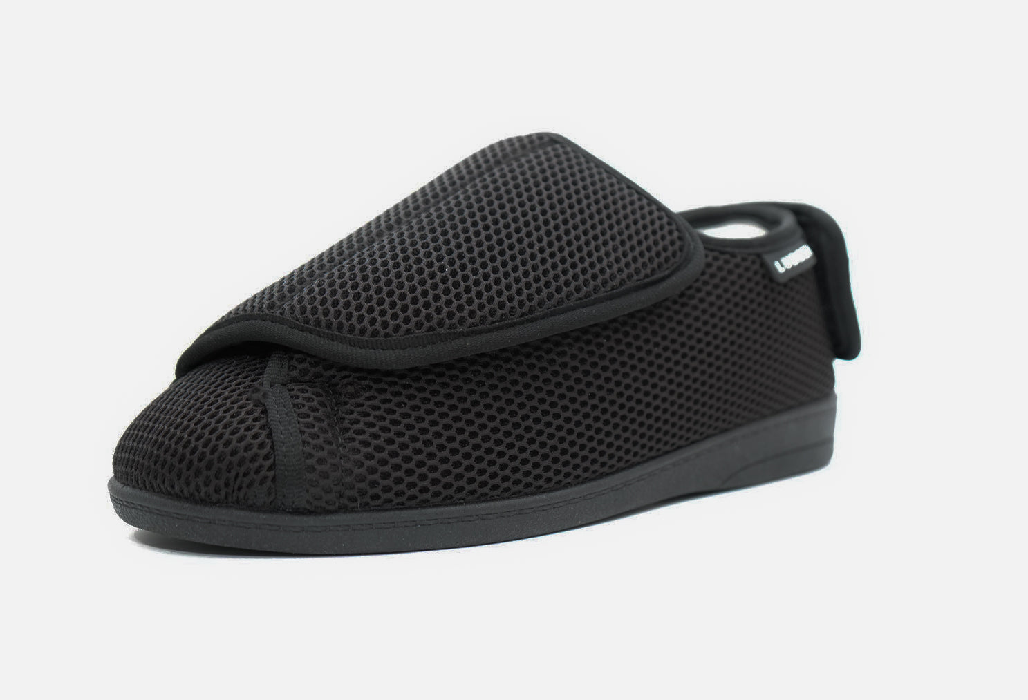 A black women's diabetic shoe with a velcro strap and a mesh upper.
